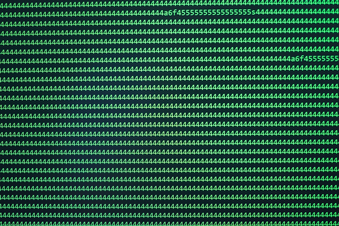 Scrolling green code on black screen - green and black striped textile