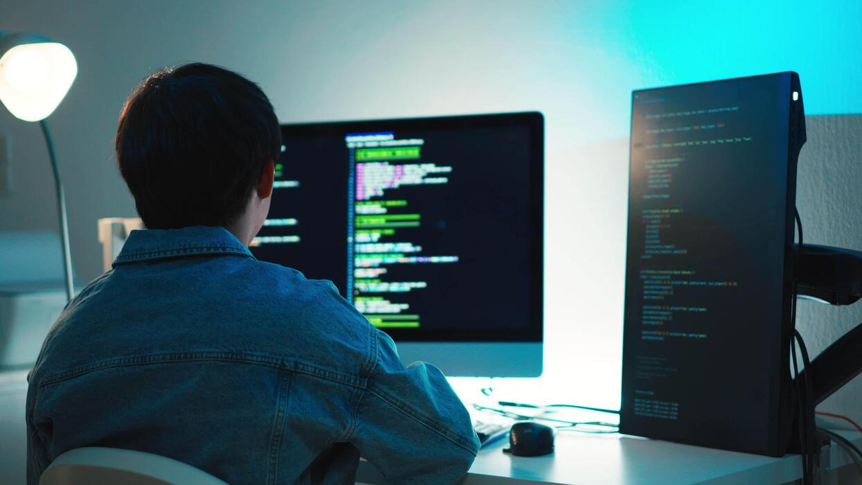 programmer debugging code - Programmer debugging code on multiple screens for software ...